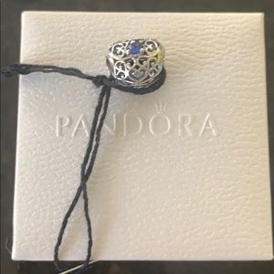 Pandora charm heart with blue stone in the center